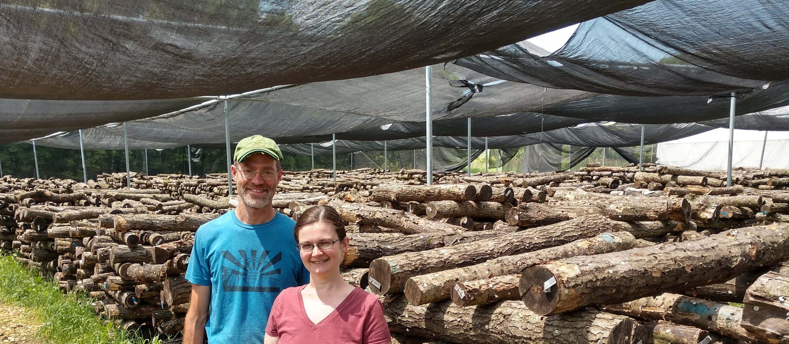 https://millcityfarmersmarket.org/wp-content/uploads/Aimee-and-Jeremy-in-shade-structure-scaled.jpg